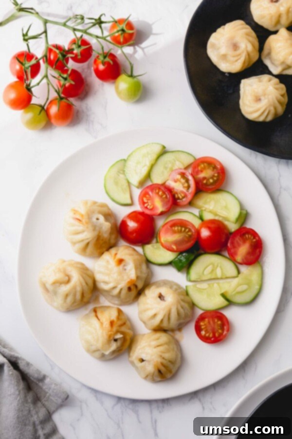 Neatly arranged dumplings on a flat surface, ready for cooking