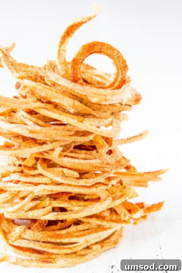 Crispy oven-baked apple strings that taste like freeze-dried apples, made easily in your oven.