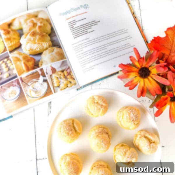 Close-up of golden-brown pumpkin cream puffs, freshly baked and ready for filling, showcasing their perfect texture.
