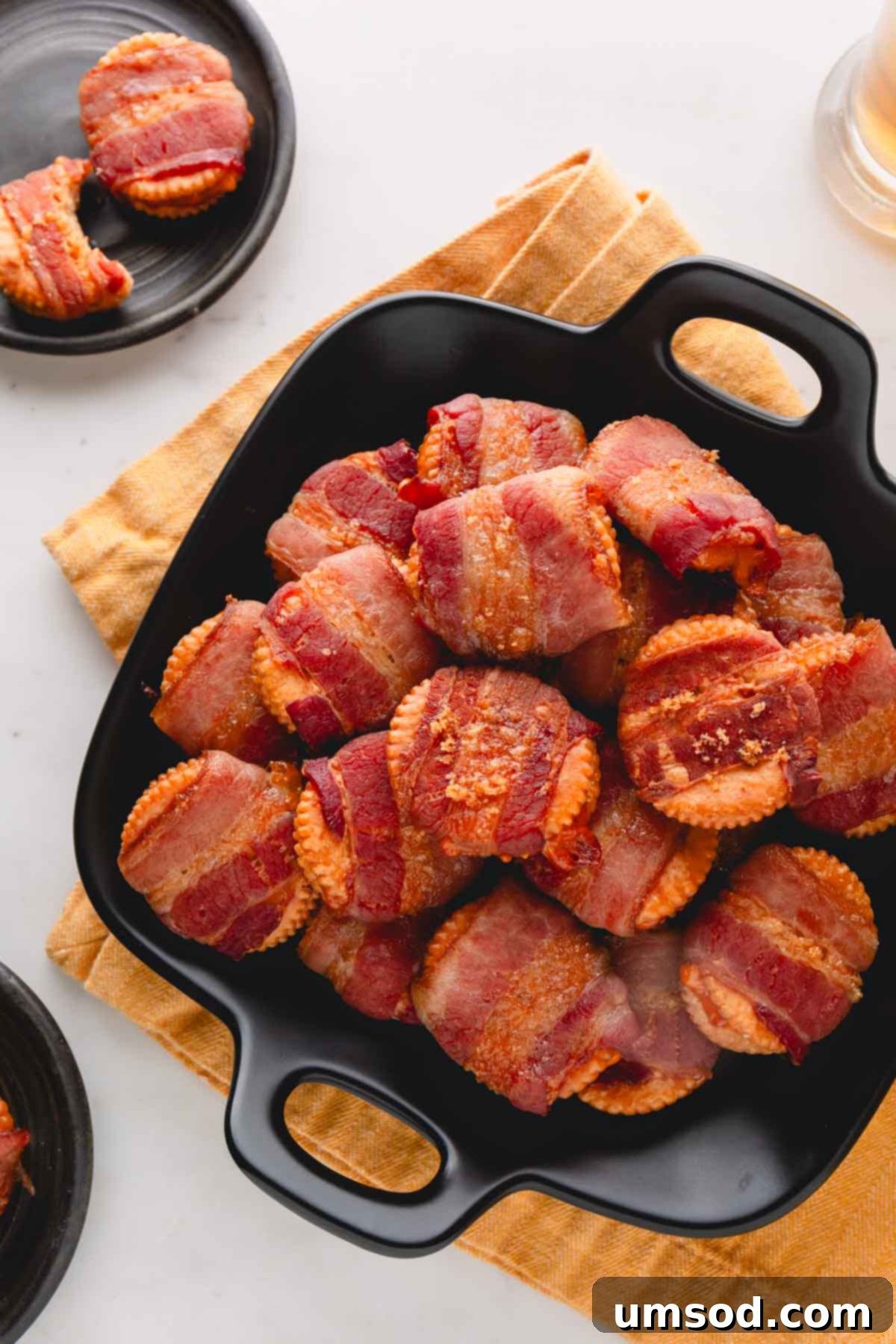 Smoky Bacon Cheese Bites 2 A bowl of freshly baked cheesy bacon crackers, golden brown and glistening with a hint of melted cheese.