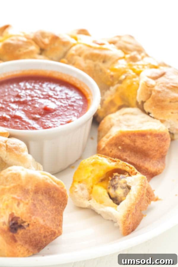 Deliciously easy meatball stuffed monkey bread, a perfect savory appetizer for any crowd.