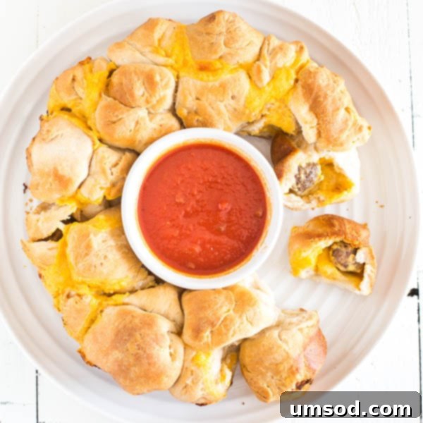Close-up of golden brown meatball and cheese stuffed monkey bread, ready to be served.