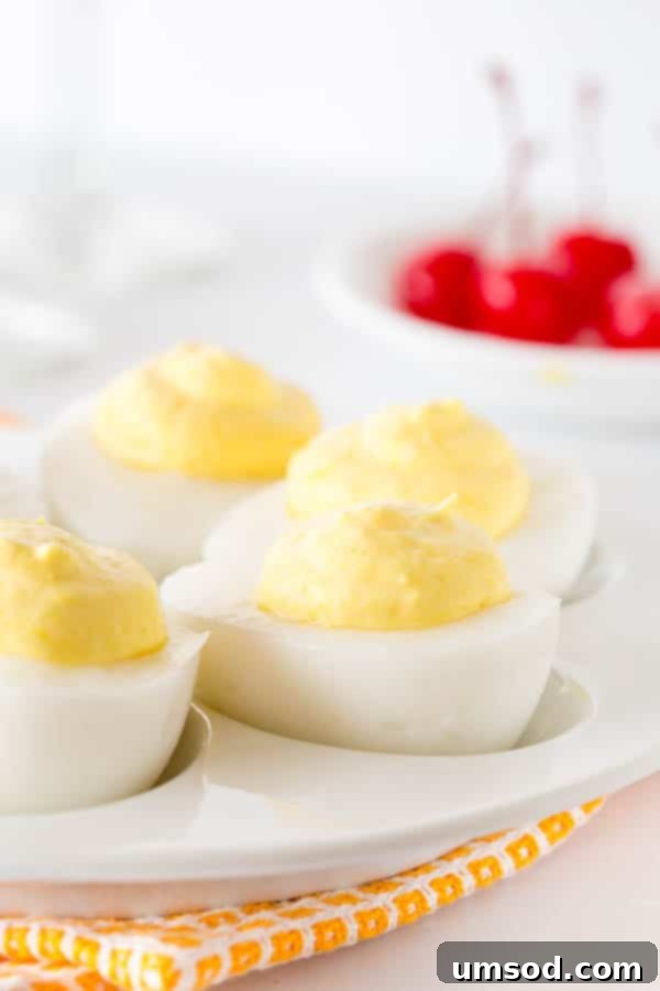 A platter of beautifully arranged sweet Pina Colada deviled eggs, ready to surprise and delight guests.