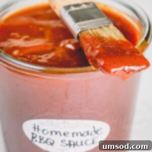 Easy Homemade BBQ Sauce Recipe 5 A jar of homemade BBQ sauce with a brush