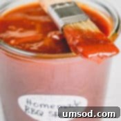 Easy Homemade BBQ Sauce Recipe 6 A jar of homemade BBQ sauce with a brush