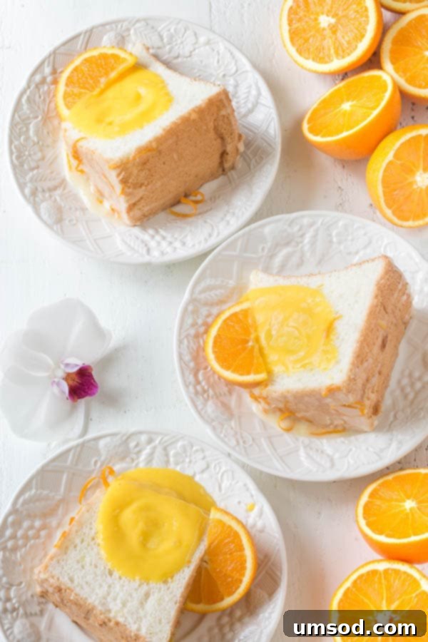 Infused with citrusy floral orange blossom, this angel food cake is simply the BEST! And you sure don't want to omit that orange curd, it takes this cake from great to FABULOUS!
