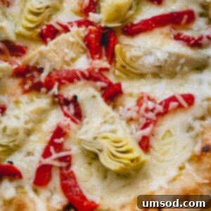 A whole grilled artichoke pizza.