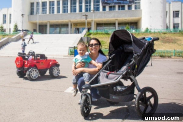 Grant observing the sights of Erdenet from his stroller, captivated by the new environment.