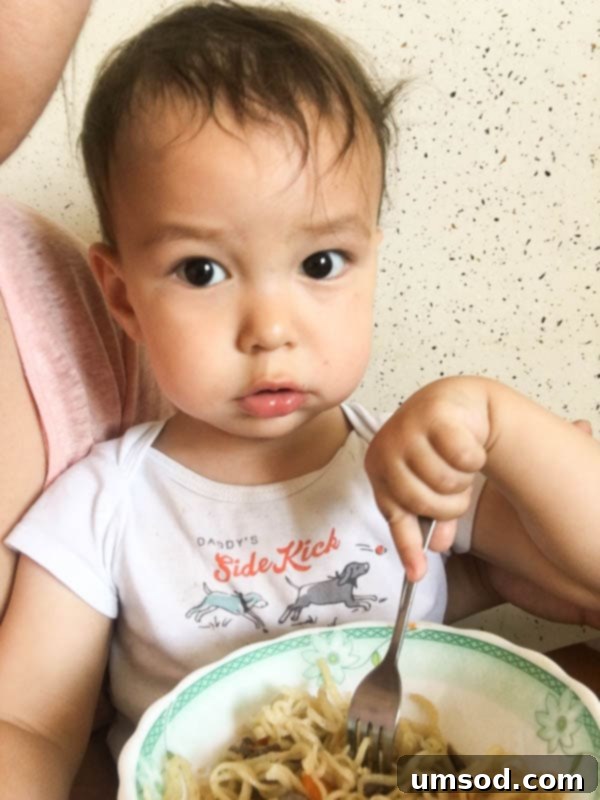 A closer look at Grant's curiosity as he watches the world go by from the balcony.