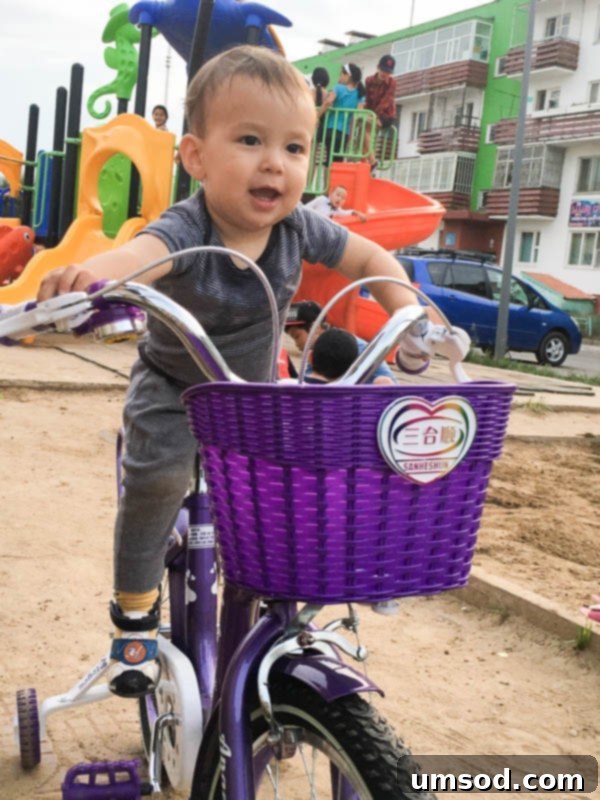 Grant trying to master a big-boy bike, a hilarious moment in Mongolia.