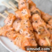 Sticky Honey Sesame Salmon Skewers 6 Close-up of a perfectly cooked honey sesame salmon kebab.