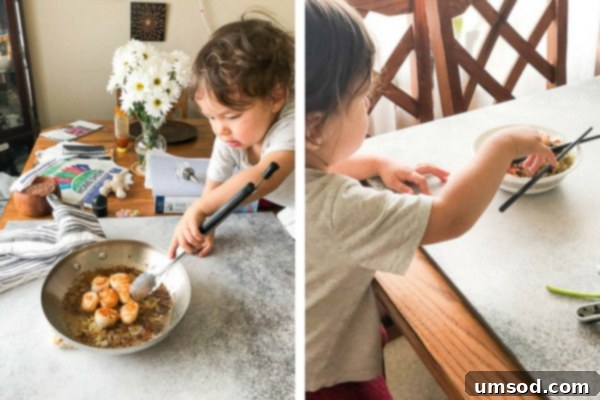 Toddler Grant intently arranging seared scallops on a plate, demonstrating early food styling skills.
