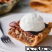 Pecan pie slice with whipped cream