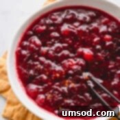 Homemade Orange Cranberry Sauce 8 Cranberry sauce in a large white bowl, presented beautifully for a meal.