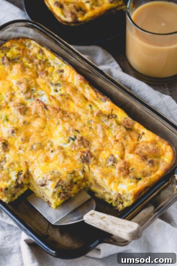 Stuffing Revival Breakfast Bake 2 A golden-brown Leftover Stuffing Breakfast Casserole with a few slices missing, showing its rich, cheesy interior.