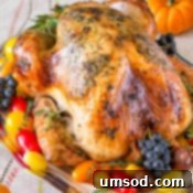 The Secret to a Gorgeously Juicy Brine-Free Thanksgiving Turkey 9 A side view of the perfectly roasted turkey, showing its golden-brown skin.