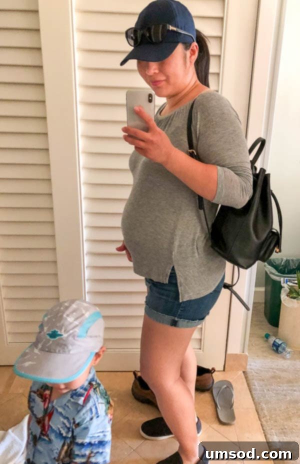 2018 Kicks Off With Exciting News 3 Grant interacting with mommy's baby bump, showing his growing excitement for his new sibling.