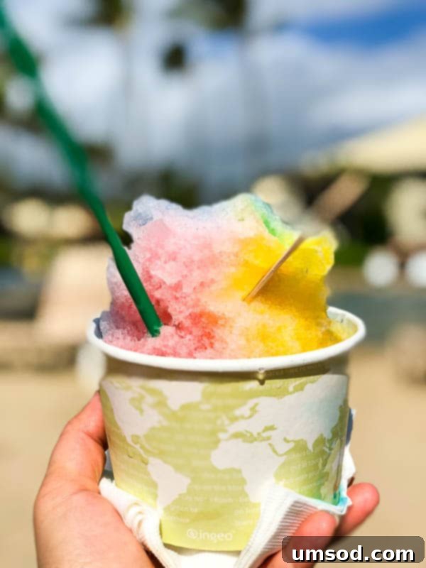 Toddler playing on a beautiful Kauai beach with calm turquoise waters