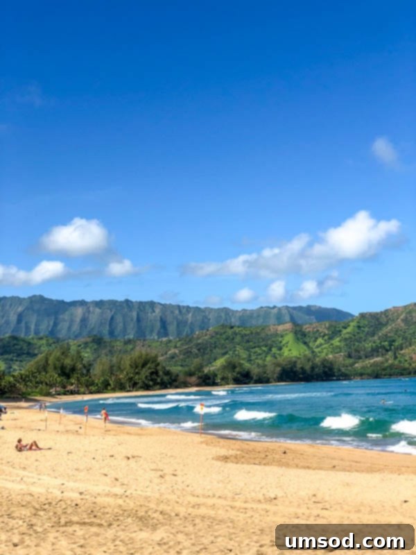 Toddler Friendly Kauai Exploring the Garden Isle 24 Golden sand beach with turquoise water on Kauai's serene coastline