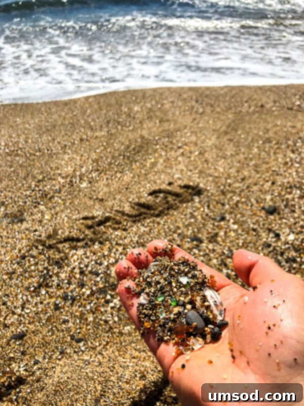 Toddler Friendly Kauai Exploring the Garden Isle 34 Close-up of the unique colorful glass sand at Glass Sand Beach, South Shore Kauai