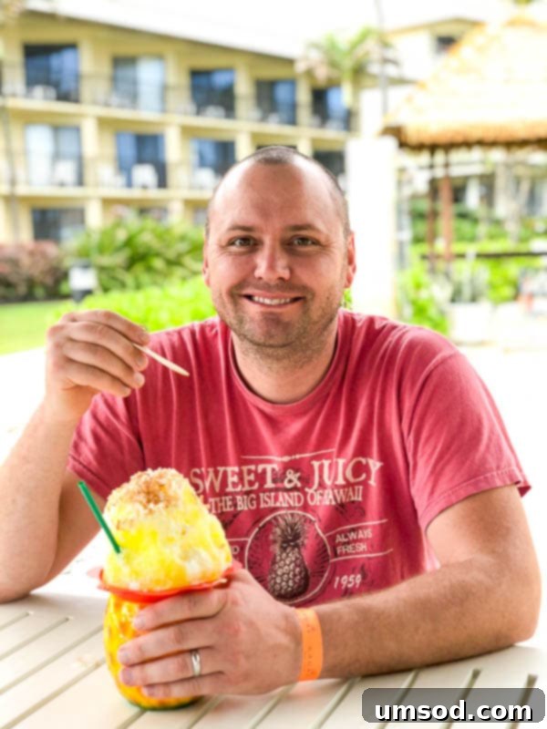 Mother and toddler relaxing by the pool at a Kauai resort