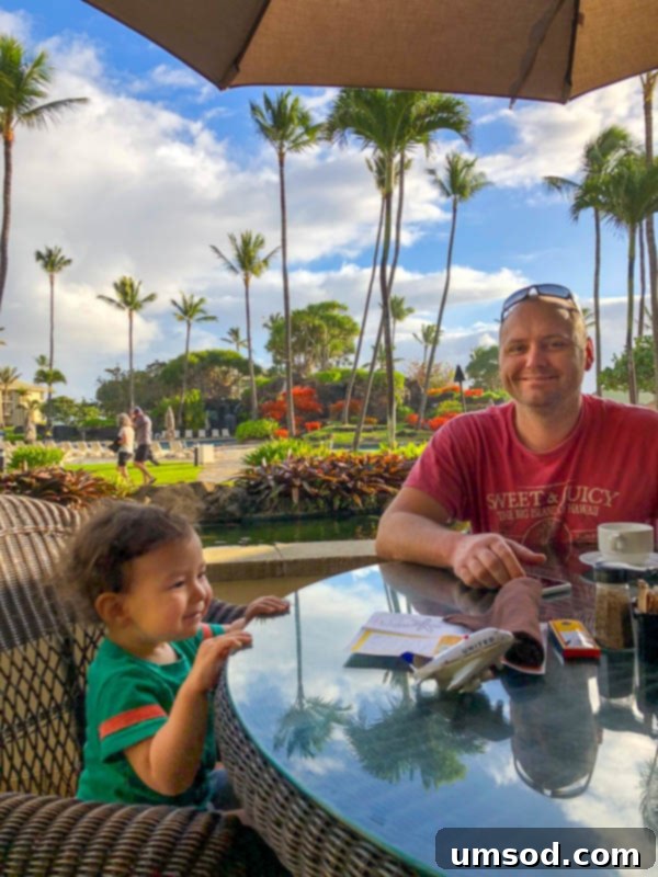 Toddler Friendly Kauai Exploring the Garden Isle 53 Toddler Grant patiently waiting for breakfast at a Hawaiian resort