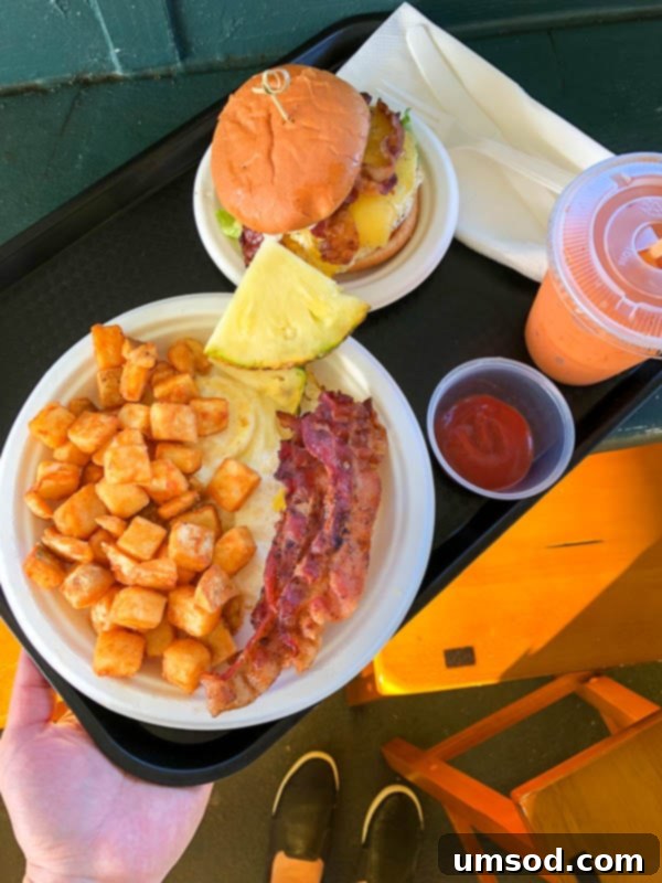 Toddler Friendly Kauai Exploring the Garden Isle 56 Breakfast plate with eggs and sausage at Kalapaki Beach Hut