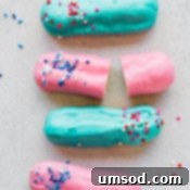 Pink or Blue Eclair Mystery 7 A beautifully completed Gender Reveal Eclair, showcasing its delicious filling and festive decoration.