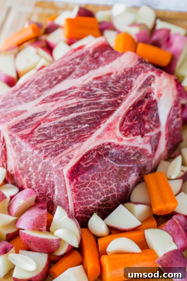 Close-up of highly marbled Wagyu chuck roast, showcasing the exceptional fat distribution that leads to tender, flavorful pot roast.