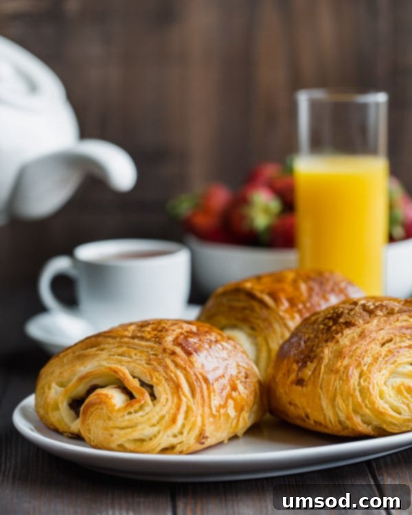 Flaky Chocolate Indulgence 11 Step by step tutorial for flaky, buttery chocolate croissants. #painauchocolat #homemadechocolatecroissant #croissant