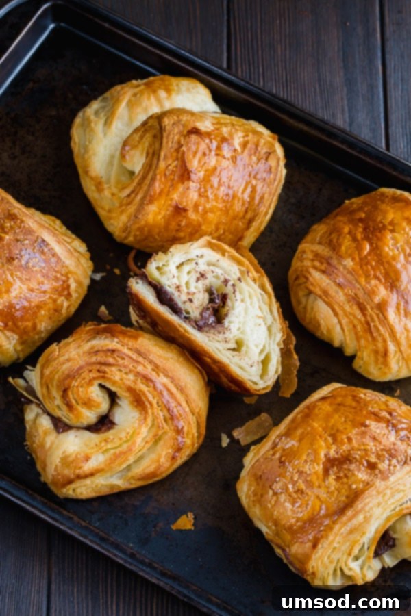 Flaky Chocolate Indulgence 3 Homemade chocolate croissants from scratch is easier than you may think. You just need a little bit of patience and rolling skills. #painauchocolat #homemadechocolatecroissant #croissant
