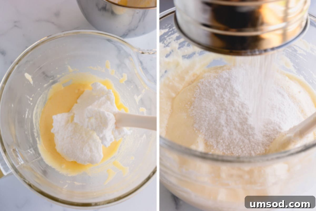 Sifted dry ingredients being delicately folded into the aerated egg mixture to create the sponge cake batter.