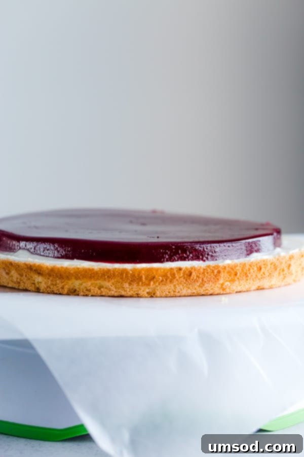 Luscious Raspberry Cream Cake 7 Delicate sponge cake layers filled with creamy sweet cream cheese frosting and raspberry jello made with real fruits. Gorgeous, tall and impressive cake for any occasion.