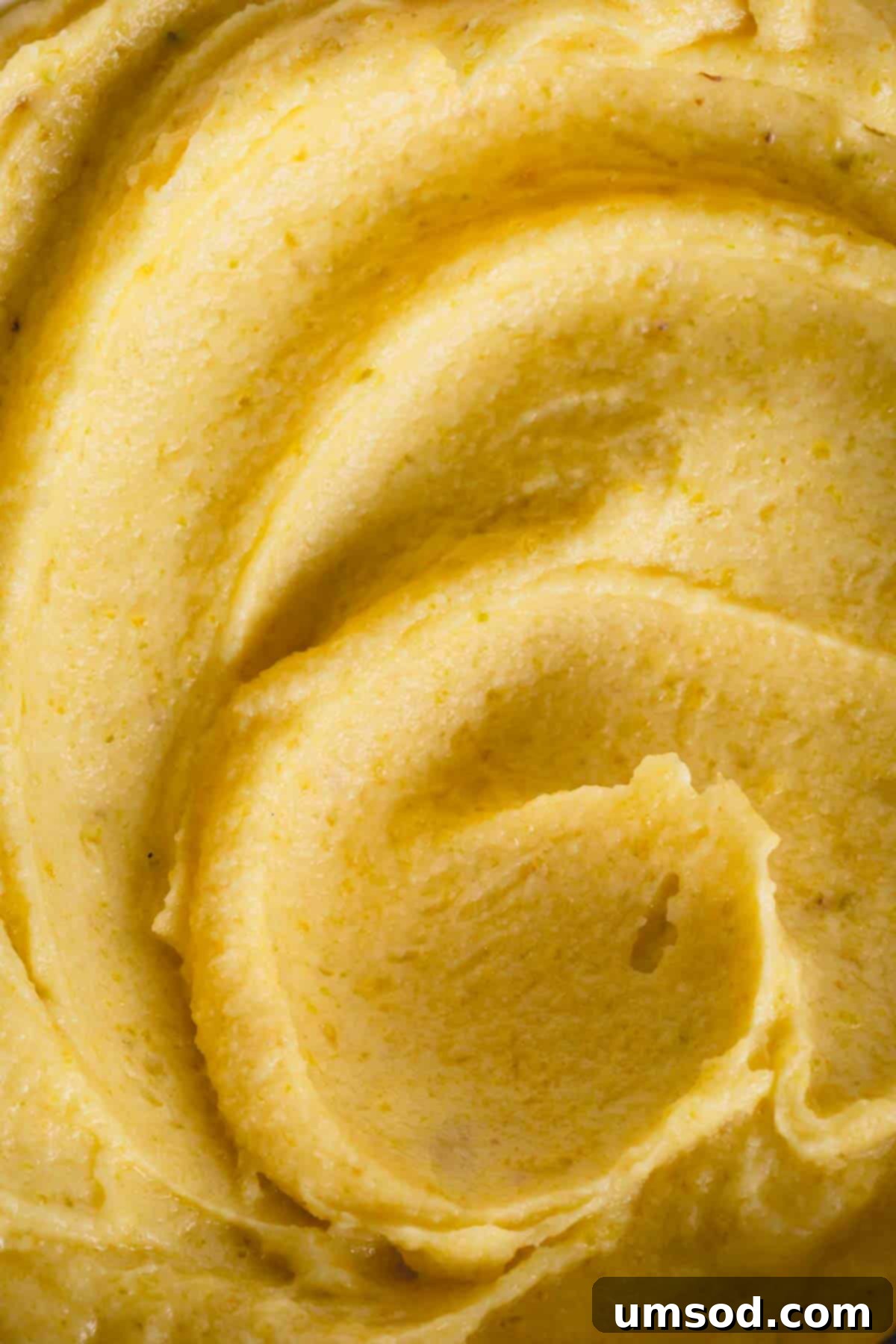 Velvety Pistachio French Buttercream Filling 2 Close-up of vibrant green pistachio buttercream, showcasing its smooth and creamy texture, ready for use as a filling or frosting.