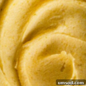 Velvety Pistachio French Buttercream Filling 6 Close-up of a beautifully piped pistachio buttercream swirl, highlighting its smooth texture and vibrant green color.