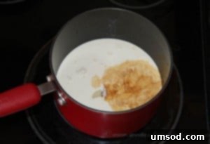 Beating egg yolks with the remaining sweetened condensed milk until the mixture turns pale and creamy.