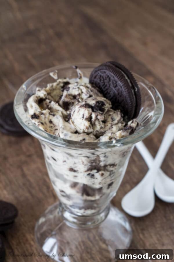 Generous scoops of creamy homemade Oreo Ice Cream in a bowl, showcasing its rich texture and plentiful cookie chunks, ready to be enjoyed.