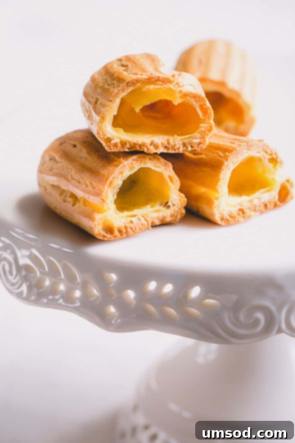 A selection of baked choux pastry shells in various shapes, highlighting their versatility.