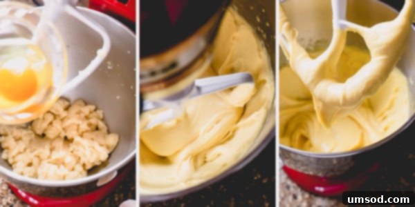 Eggs being gradually incorporated into the cooked choux pastry dough in a stand mixer.