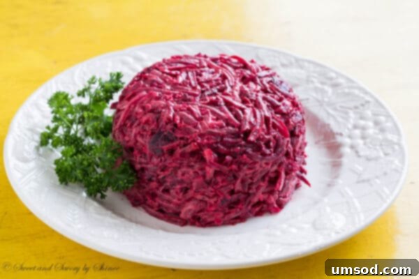 Close-up of the creamy roasted beet salad, highlighting the tender beet chunks coated in a rich, white dressing.