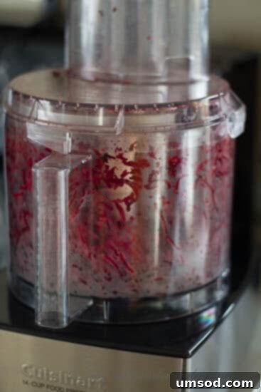 Step-by-step image of mashing roasted garlic with a fork.