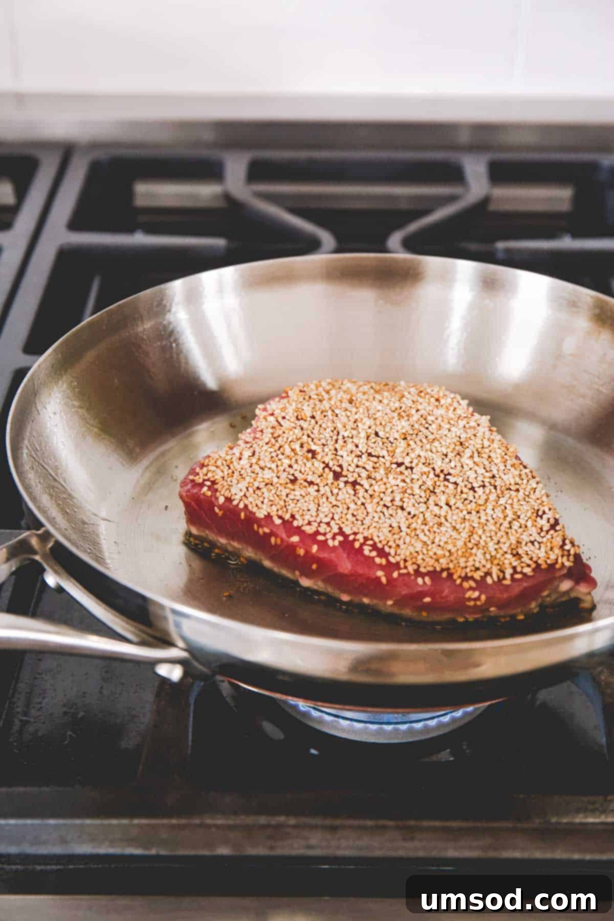 Sesame-Crusted Ahi Tuna 5 Sesame crusted ahi tuna steak on a skillet.