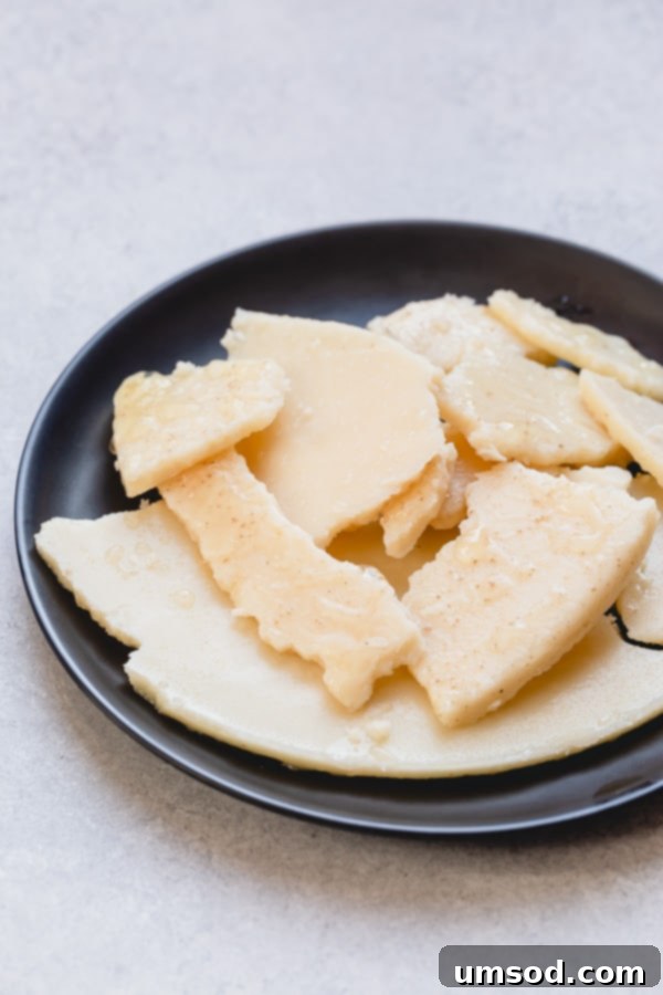 The Essential Guide to Beef Bone Broth 5 Skimming the fat layer from chilled beef bone broth.