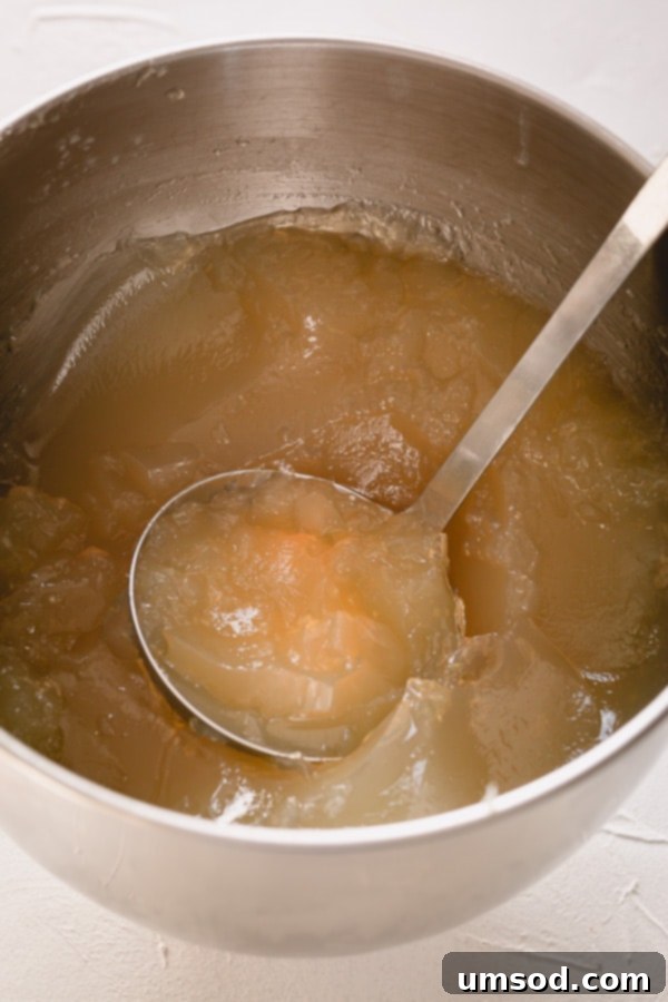 The Essential Guide to Beef Bone Broth 6 A pot of beef bones simmering, producing a rich, gelatinous broth.