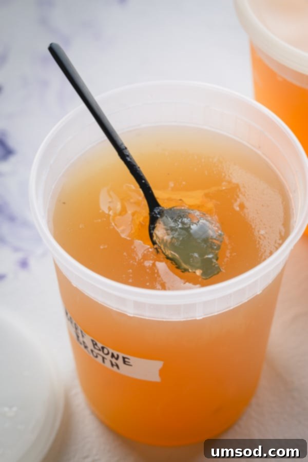 The Essential Guide to Beef Bone Broth 8 Various sizes of frozen beef bone broth in reusable containers.