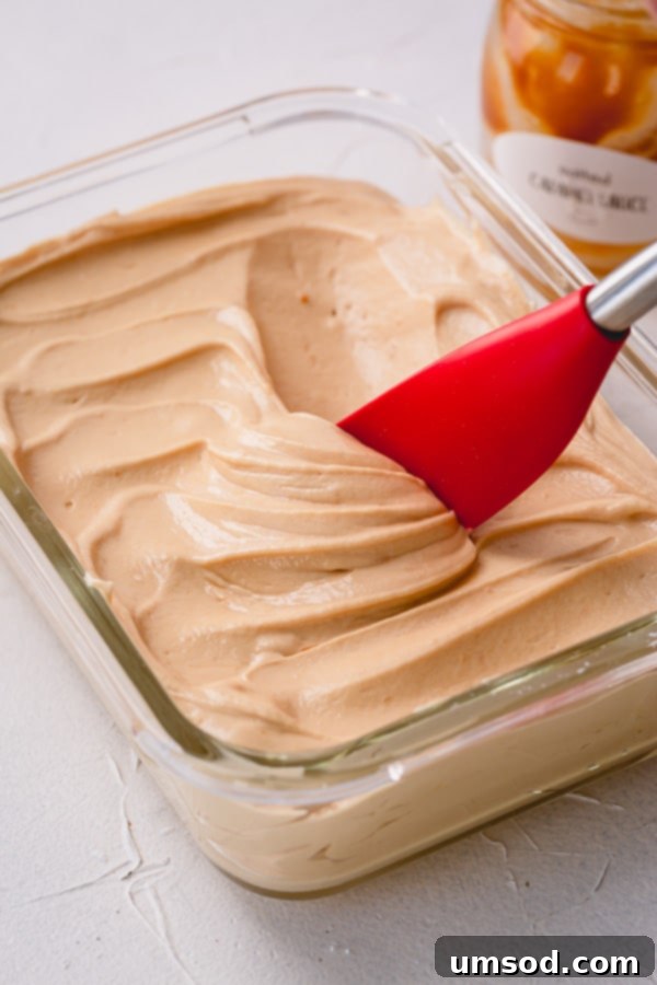 Light and fluffy salted caramel buttercream frosting ready to be used, showcasing its smooth texture.