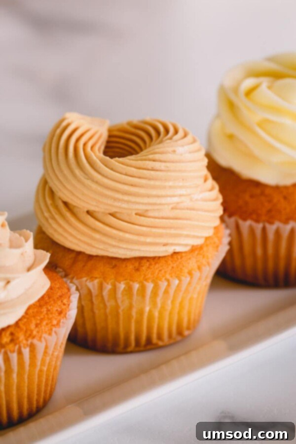 Close-up of creamy salted caramel buttercream in a mixing bowl, highlighting its smooth texture.
