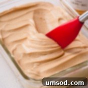 A final close-up of the delicious salted caramel buttercream, irresistible and ready for use.