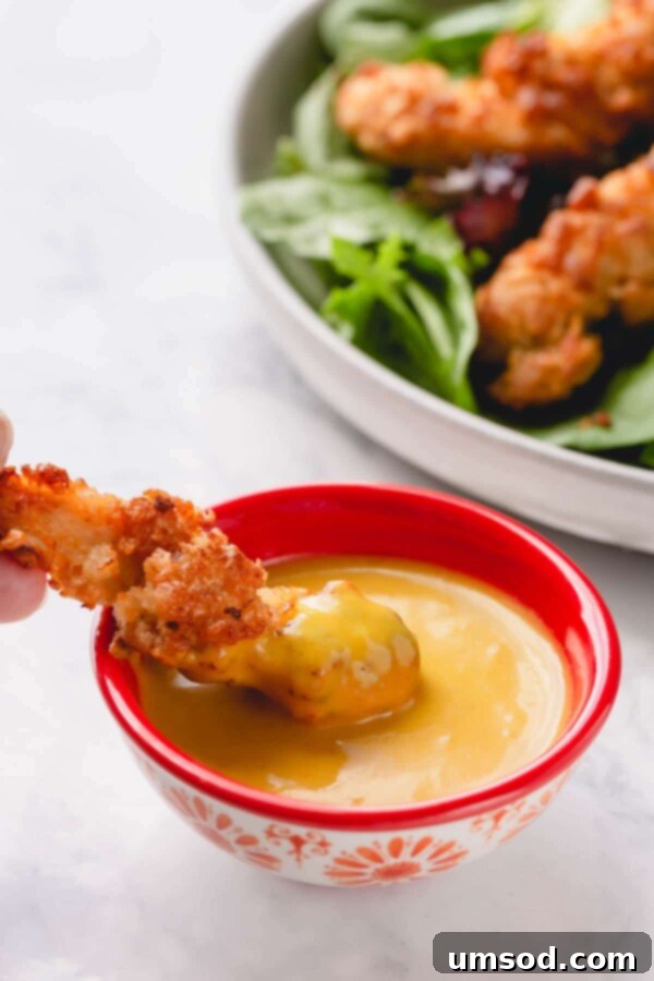 Dip into Delight: 5 Mouthwatering Sauce Recipes 6 A top-down view of a selection of finger foods, including crispy fries and chicken nuggets, perfectly arranged for dipping.