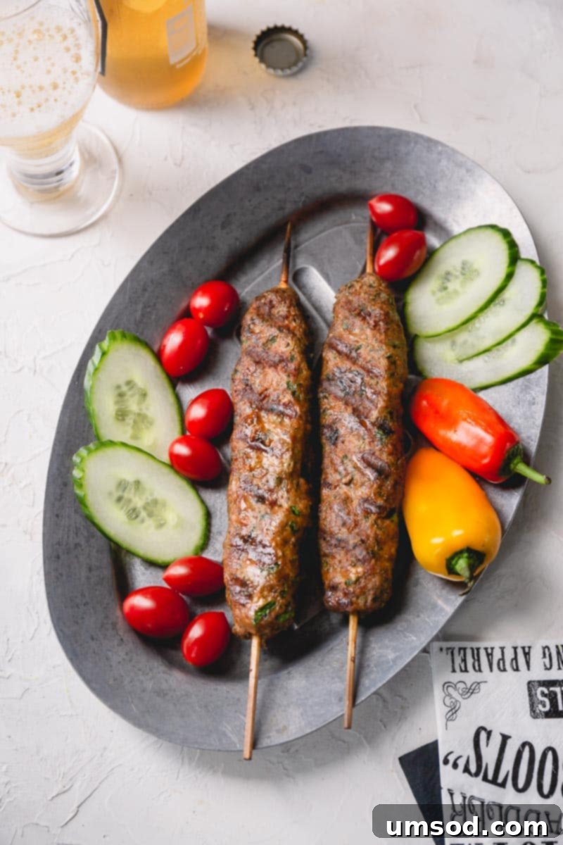 Urfa Kebab Excellence 3 Close-up of freshly prepared Urfa kebabs on a cutting board, highlighting the perfect texture before grilling